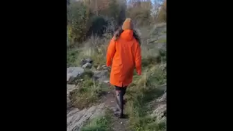Taking a Stroll in Orange Raincoat and Rubber Boots
