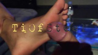 Footjob in front of TV
