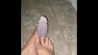 Giving my dildo a footjob with my cute feet