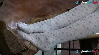 Sweet blonde teeny Valeria gives a full foot tease show in this mix of film. First you see her wearing green heels and white fashion stockings. Then sandals and dark stockings. Her dangling shoeplay and her smile will melt you down in no time