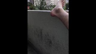 Flashing masturbating at balcony near many building two