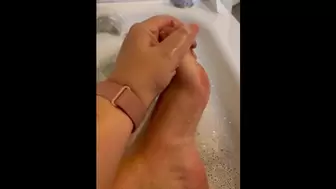 Exfoliating my feet in the tub