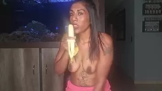 Topless desi squeezes her melons as she blows and deepthroats on a banana